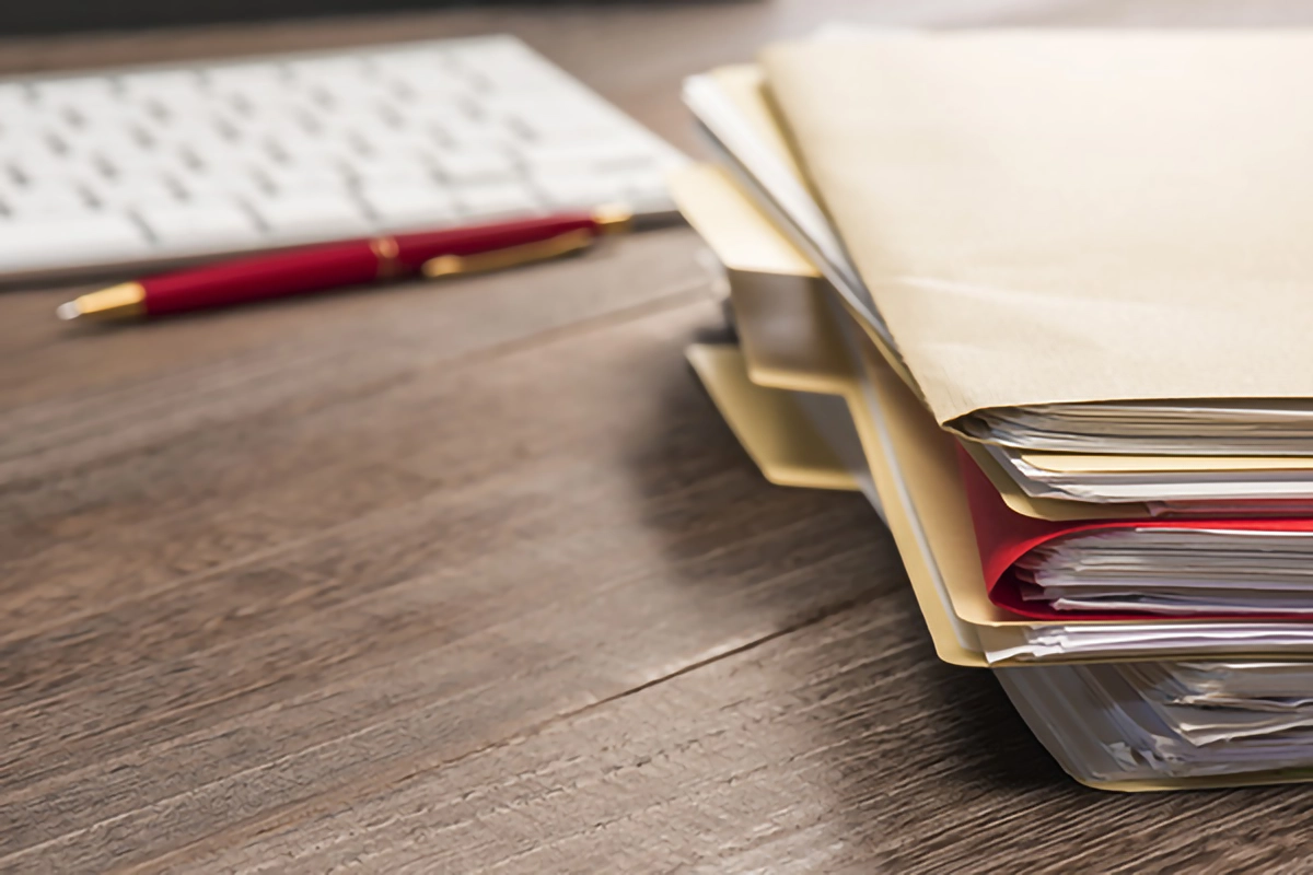 Image of files on a computer desk