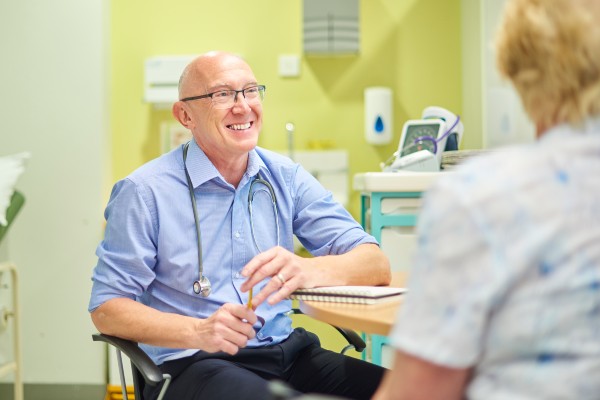 A GP speaking to a patient